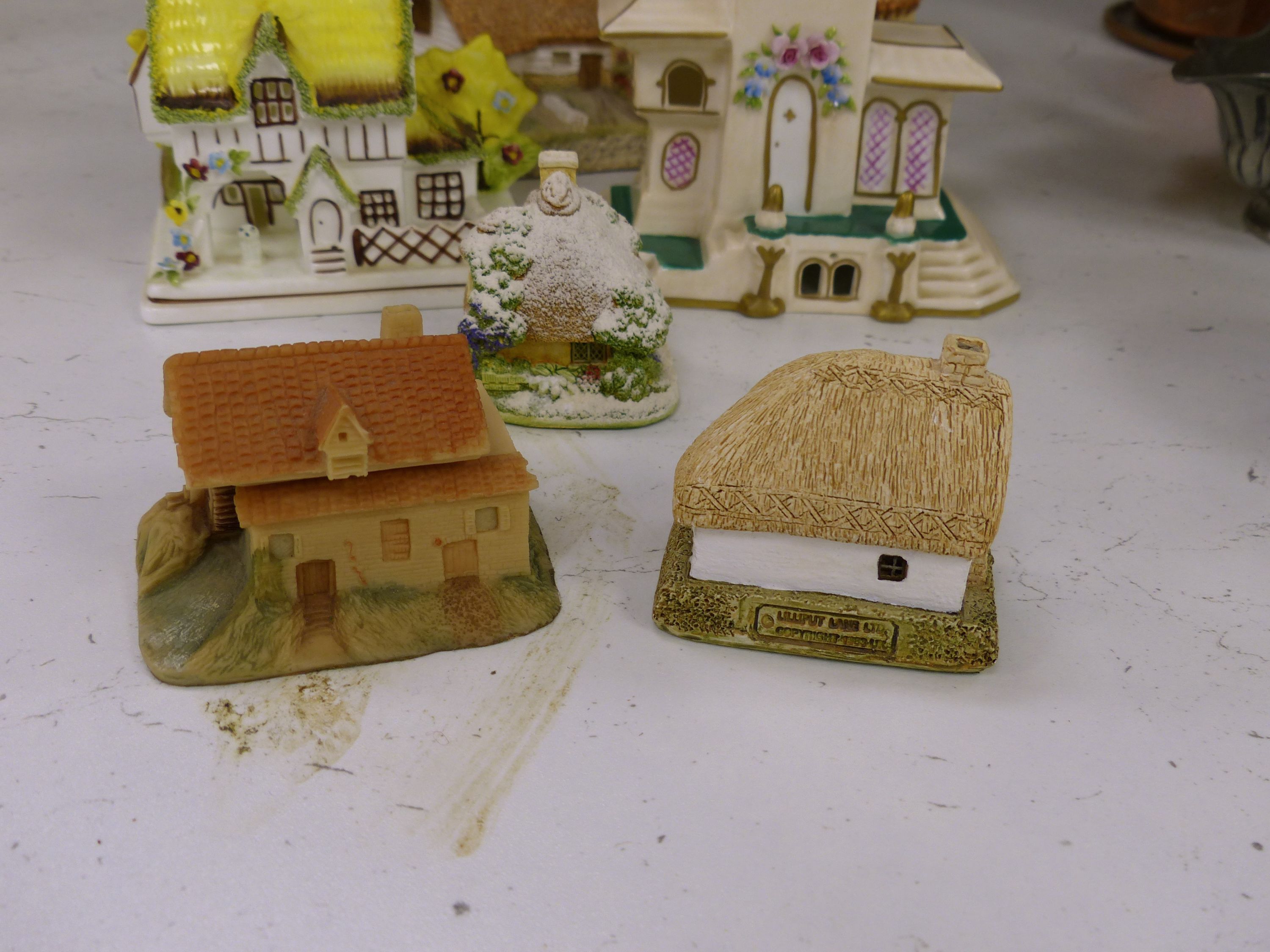 Seven Coalport bone china 'cottage' pastille burners and four similar resin examples (11)